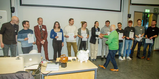 Presentation of the Alumni Award to the XAI project group.